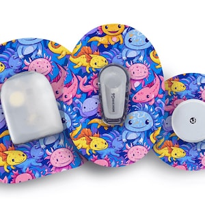 May include: Medical device accessories with an axolotl design. The set includes a sensor, transmitter, and receiver, set against a blue backdrop. The axolotls are depicted in pink, yellow, and blue, creating a playful and colourful aesthetic.
