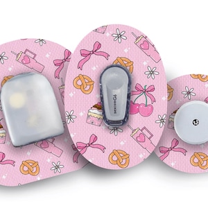 May include: Pink patterned medical device accessories with bows, pretzels, cherries, and drink illustrations. Includes a sensor and transmitter. The accessories are designed to fit medical devices.