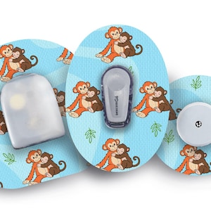 May include: Medical device accessories featuring a light blue background with a repeating pattern of hugging monkeys. The image includes a sensor, transmitter, and receiver, all with a monkey theme.