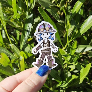 May include: A sticker of a cartoon character wearing a hat with goggles and a brown and black outfit. The character has blue hair and is holding a weapon.