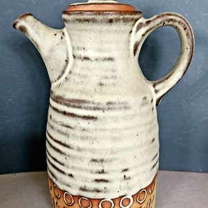 A stunning vintage studio pottery coffee pot made by Tremar Pottery, with geometric incised pattern and matt glaze, 1970's