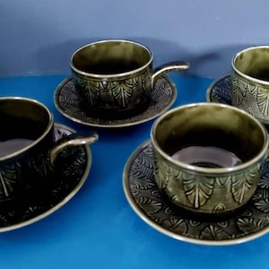 A set of four vintage forest green ceramic soup bowls with saucers, English with Scandi influence, 1970s