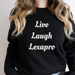 May include: Black sweatshirt with white text that reads "Live Laugh Lexapro".