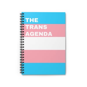 May include: A blue, pink, and white spiral bound notebook with the text "THE TRANS AGENDA" in white.
