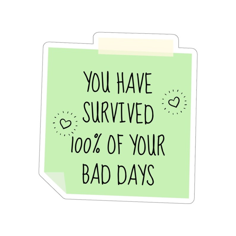 May include: Green sticky note with the text "You have survived 100% of your bad days" with two small hearts on either side of the text.