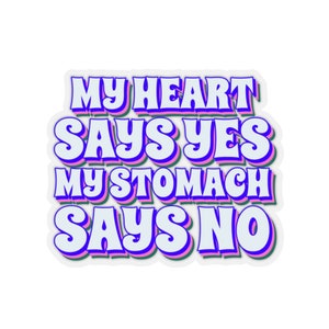 May include: A sticker with the text "My heart says yes, my stomach says no" in a retro, colorful font. The text is outlined in pink, green, and blue.