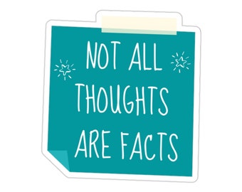 May include: Teal blue sticky note with white text that reads "Not all thoughts are facts". There are two small white stars on either side of the text.