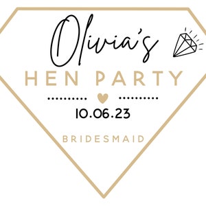May include: A diamond-shaped graphic with the text "Olivia's HEN PARTY" in black and gold. The date "10.06.23" is centered below the text, with the word "BRIDESMAID" at the bottom. A diamond illustration is in the upper right corner.