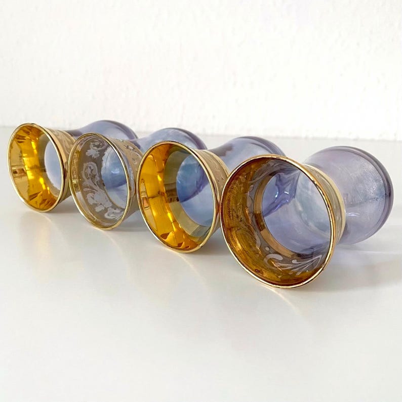 Price is for 1 Cup, 1 Saucer and 1 Spoon. Iridescent Purple Tea Glass