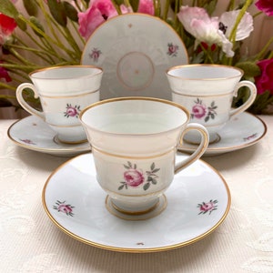 Price is for 1 Cup and 1 Saucer. White Porcelain Bing & Grøndahl Footed Cup and Saucer Set with Gold Accent and Trim. Roselil Pink Rose