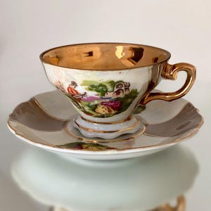 Courting Couple Romantic Rococo Style and Lavish Gold Accent. Antique Footed Pearl Lustre Demitasse Cup and Saucer Set. No Marking nor Name