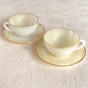 Arcopal France Creamy White Assorted Vintage Opaline Glass Cup and Saucer Set with Gold Trim. Has Color Variations. Price is for 1 Cup Set!