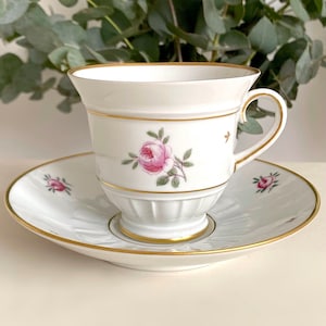 Very Rare Roselil Bing & Grøndahl. Large White Porcelain Footed Cup and Saucer Set with Pink Rose Motive and Gold Trim. Made in Denmark