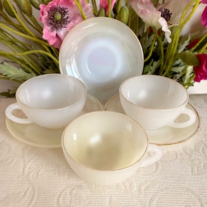 Price is for 1 Cup and 1 Saucer. Arcopal France Creamy White Assorted Glass Cup and Saucer Set with Gold Trim. Has Fading, Color Variations!