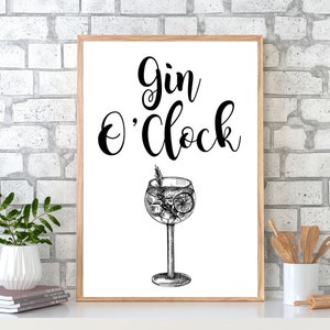 May include: A white framed print with black text that reads "Gin O'Clock" and a black and white illustration of a gin and tonic.