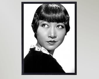 May include: Black and white portrait photograph of a woman with short, straight, dark hair. She is wearing a dark dress with a white lace collar. The woman is looking off to the side and has a serious expression on her face.