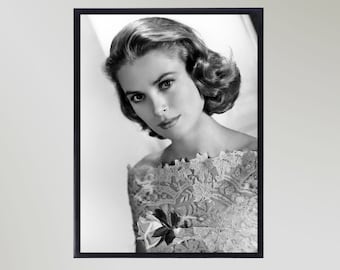 May include: Black and white portrait photograph of a woman with short, curly hair wearing a lacy dress. She is looking directly at the camera with a soft smile.