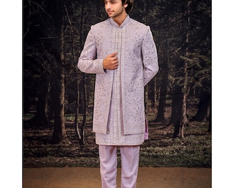 May include: A light purple, embroidered formal outfit. The ensemble includes a long, open jacket, a tunic, and matching pants. The outfit is adorned with intricate patterns and details. The image also includes the text "No.2437-PINK".