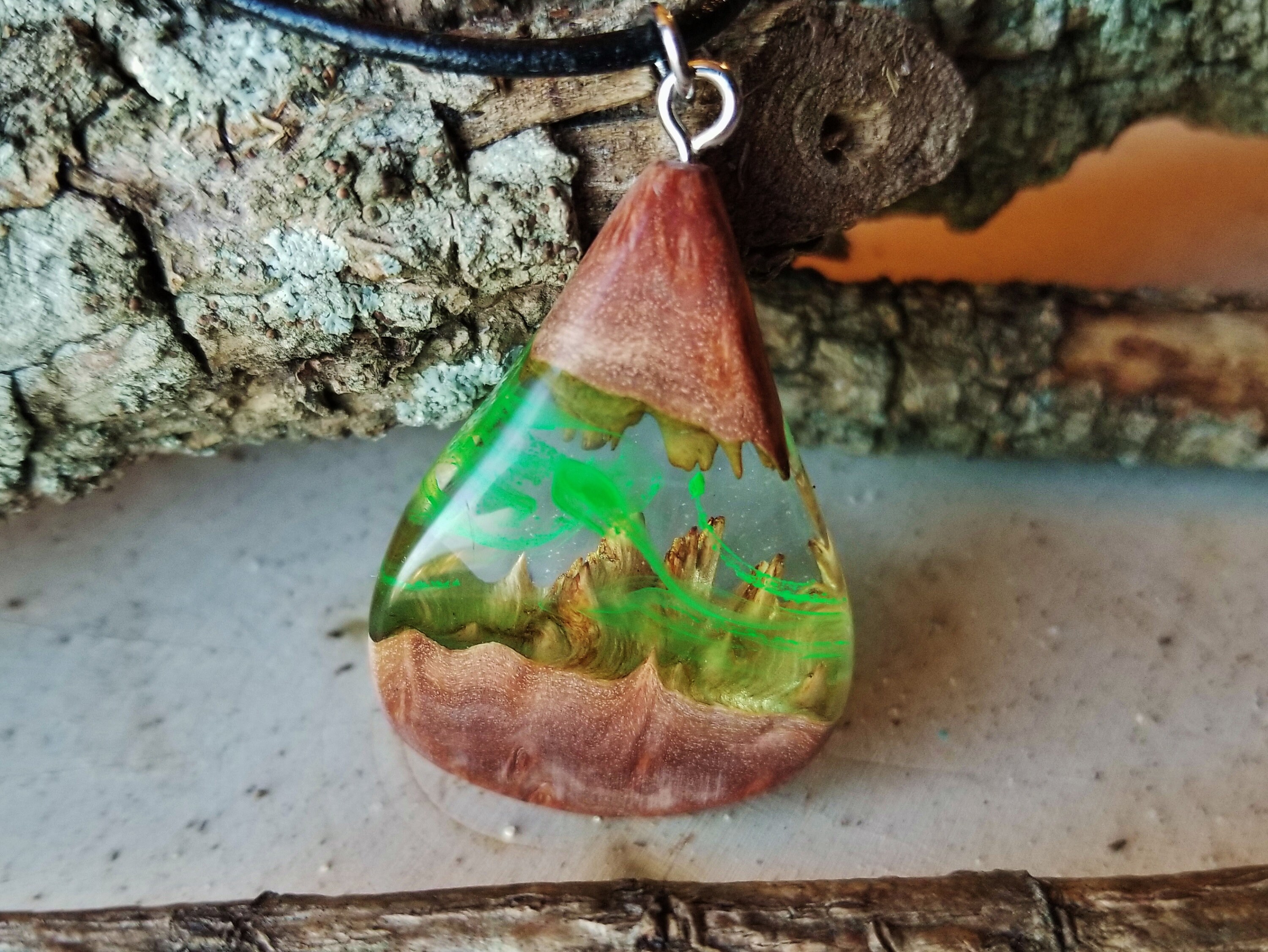 Aurora borealis pendants made with oil and resin