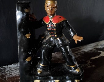 Vintage Hand Painted Ceramic Figurine Of Asian Boy In Red and Black Uniform