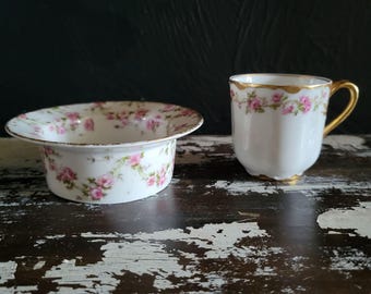 Tazza da tè e piattino da ciotolina vintage Limoges Haviland con decorazioni floreali di rose rosa e bordo dorato.