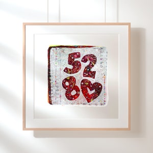 May include: A framed print of a colorful artwork featuring the numbers 52 and 80, along with a heart shape, all in a red and white color scheme.