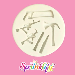May include: A circular white silicone mould featuring tool and weapon shapes: a saw, rifles, a hammer, and bullets. The mould is set against a pink background. The word "Sprinklify" is written in a colourful, cursive font at the bottom.