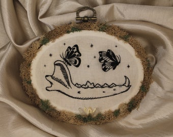 Jaw and butterfly embroidery