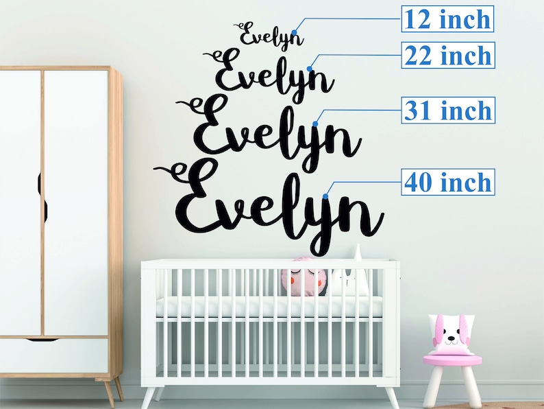 May include: Four black vinyl wall decals spelling out the name "Evelyn" in a cursive font. The decals are shown in different sizes, measuring 12 inches, 22 inches, 31 inches, and 40 inches.