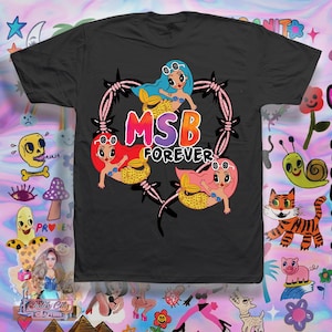 May include: Black t-shirt with a pink heart design featuring three cartoon mermaids with the text "MSB FOREVER".