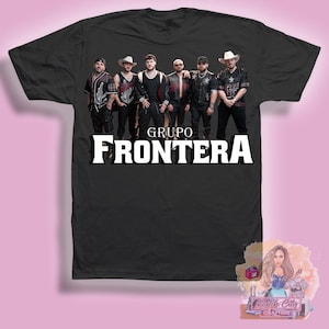 May include: Black t-shirt with a group of five men wearing hats and dark clothing. The text "GRUPO FRONTERA" is printed in white on the shirt.