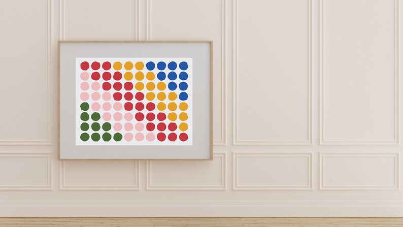 May include: A framed print of a colorful abstract design featuring a grid of circles in shades of green, pink, red, yellow, and blue.
