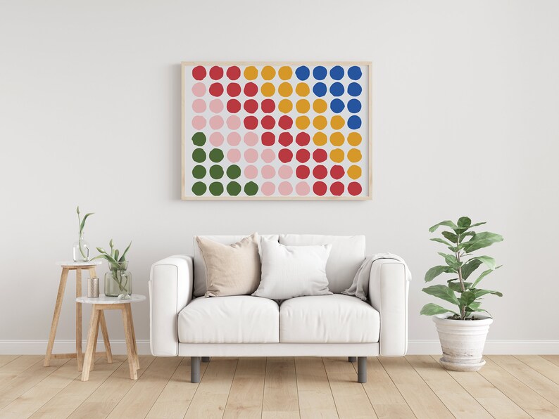 May include: A framed print of a colorful abstract design featuring a grid of circles in shades of red, pink, green, yellow, and blue.