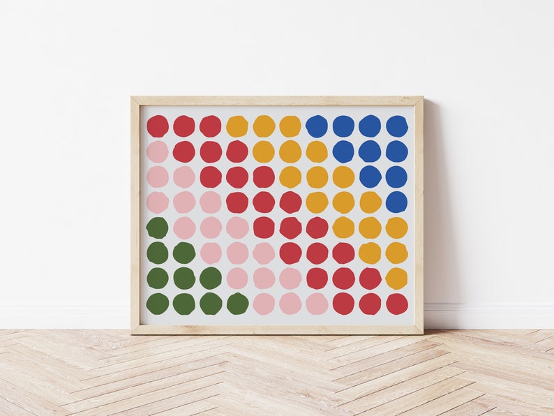 May include: A framed print with a geometric pattern of colorful circles in shades of pink, red, green, yellow, and blue.