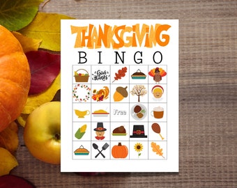 May include: A printable Thanksgiving Bingo card with images of a cornucopia, a turkey, a pumpkin, a pie, and other Thanksgiving-themed items. The card has a free space in the center and says "Thanksgiving Bingo" at the top.