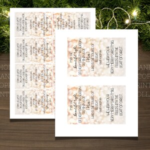 May include: A set of printable Christmas gift tags with a gold glitter background and the text "May the beautiful light of every Christmas season remind us of Him who is the source of all light."  The text is repeated on each tag with a different design.