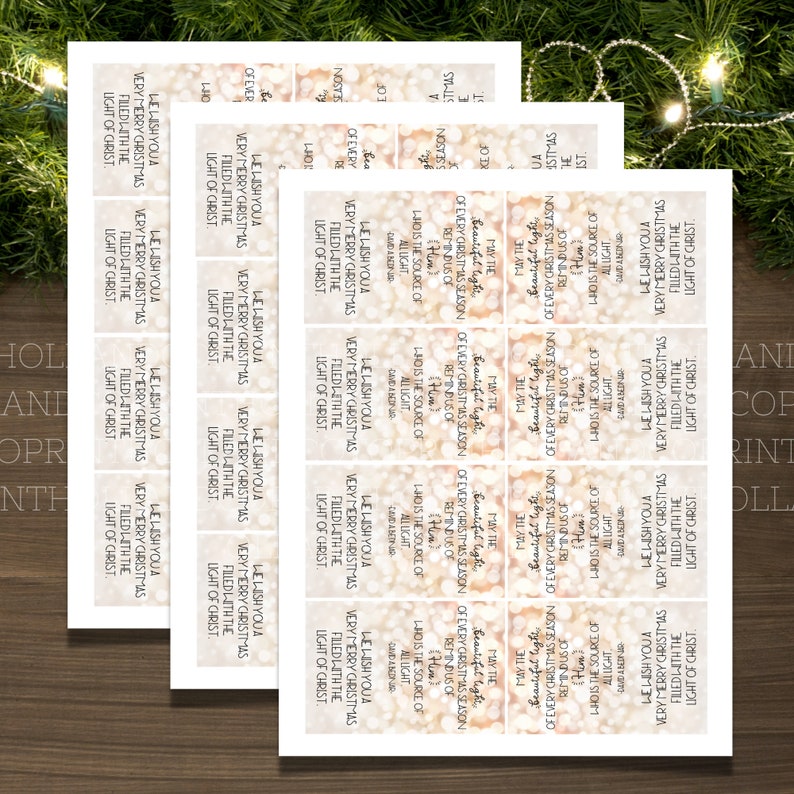 May include: A set of printable Christmas gift tags with a sparkly gold background and the text "Le'Lish You a Very Merry Christmas Filled with the Light of Christ."
