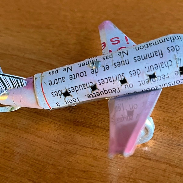 vintage handmade airplane figurine made from tin cans French