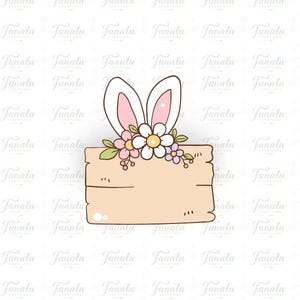 Könnte beinhalten: Cartoon-Illustration eines Holzschildes mit Hasenohren und Blumen. Das Schild ist hellbraun mit einer gebogenen Unterkante. Die Hasenohren sind weiß mit rosa Innenseiten, und die Blumen sind weiß, rosa und lila.