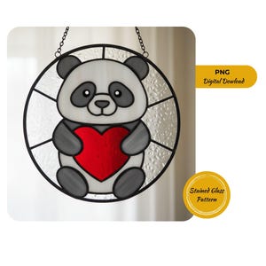 May include: A stained glass panda holding a red heart. The panda is white and grey with black accents, set within a circular frame. The frame is black and has a chain for hanging. The image includes the text "PNG Digital Download" and "Stained Glass Pattern".