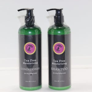 May include: Two green plastic bottles with black pump tops and labels. The bottles are labelled "Tea Tree Moisturizing Conditioner" and "Tea Tree Moisturizing Shampoo". Both bottles are 250ml (8.45 fl oz).