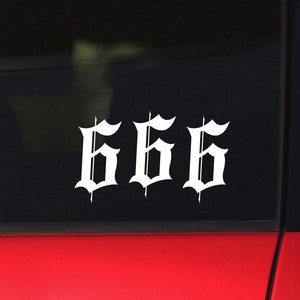 May include: A white vinyl sticker with the number 666 in a gothic font on a black background.