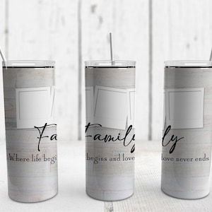 May include: Three stainless steel tumblers with a wood grain design and a white photo frame. The tumblers have the text "Family, where life begins and love never ends" printed on them.