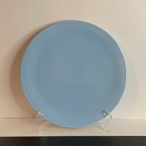 May include: A light blue ceramic dinner plate.