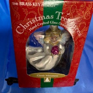 La llave de bronce presenta tesoros de Navidad adornos de ángel de vidrio hechos a mano