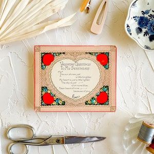 May include: A vintage Valentine's Day card with a red heart and floral border. The card reads "Valentine Greetings To My Sweetheart" and includes a poem about love and happiness.