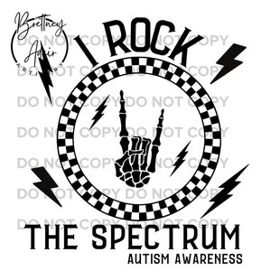 May include: Black and white graphic design with a skeleton hand making the rock and roll sign. The hand is inside a circle with a checkered pattern. The text "I ROCK THE SPECTRUM" and "AUTISM AWARENESS" are below the circle.