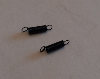 Tension spring with two loops on each end Brother knitting machine carriage, medium size. For each purchase, get one spring.