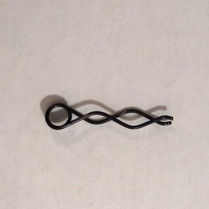 Spring for holding cam lever for electronic and punchcard Brother knitting machines, part 407333001