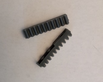 A pair of side racks (AKA end rails, end-rail guards) for Singer/Studio knitting machines.